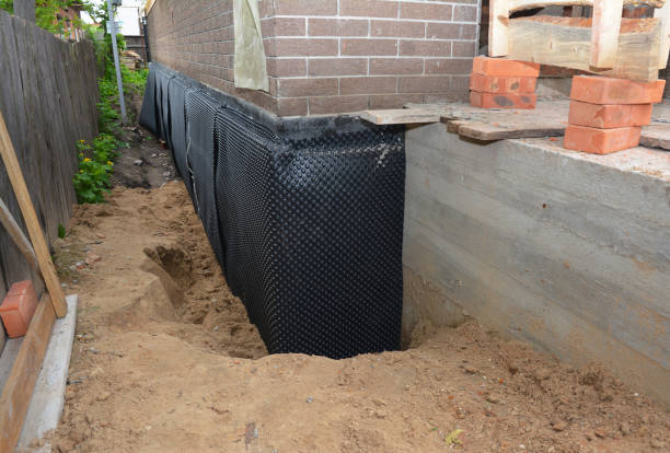 SJ Waterproofing Pros technician performing targeted Interior Drainage System assessment in Bellwood, PA